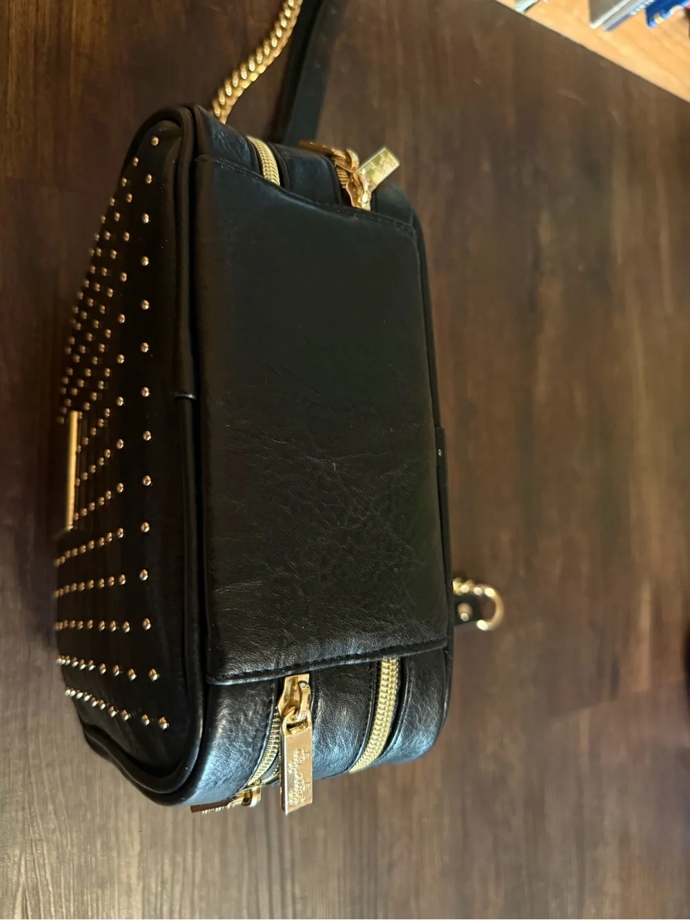 Itzy Ritzy Black Studded Crossbody with Gold Chain & Tassel
